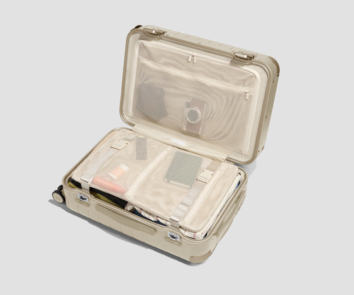 The Aluminum Edge Bigger Carry-On in Champagne White