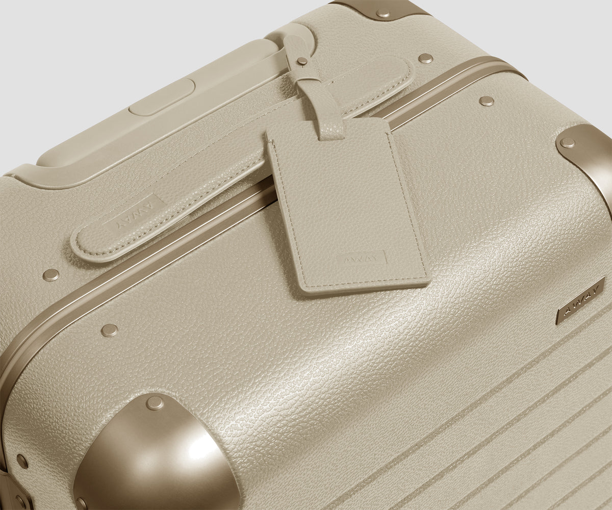 The Aluminum Edge Carry-On in Champagne White