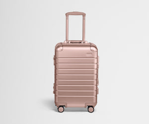 Front view of The Carry-On: Aluminum Edition in Rose Gold with handles raised