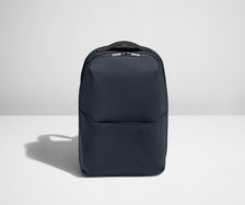 Backpack in Navy with one small pocket in the front.