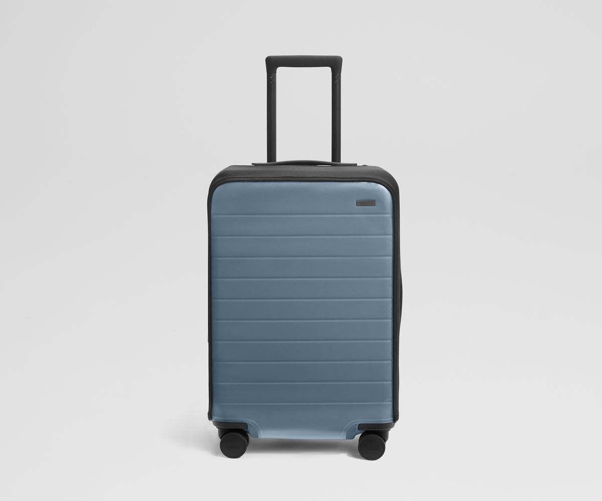 Clear Luggage Cover in The Bigger Carry-On