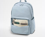 Phone, passport, and keys in their dedicated pockets in the front zip pocket