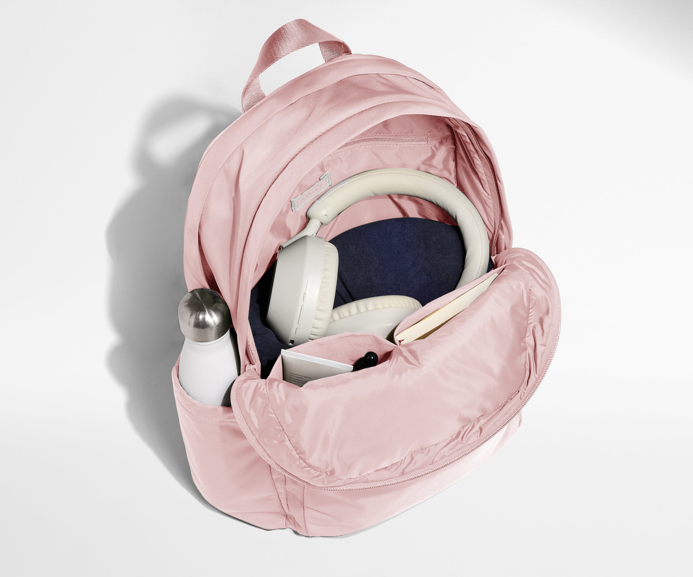 Away Large Featherlight Backpack in Blush Pink