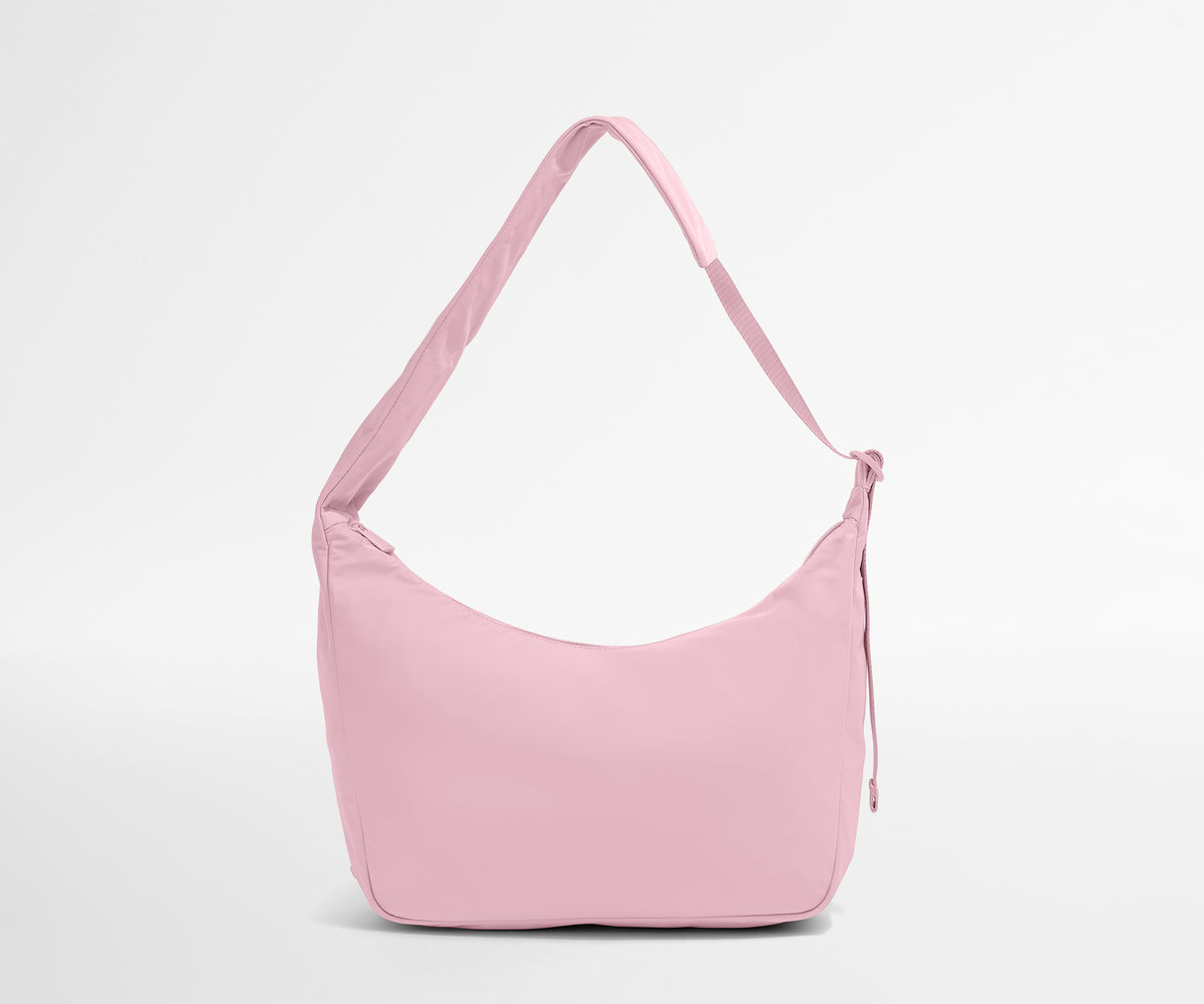 Pink shoulder bag on a light gray background
