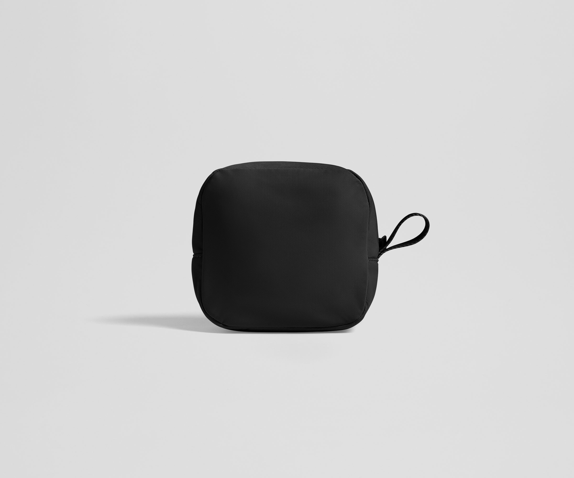 Black tech organizer on a light gray background