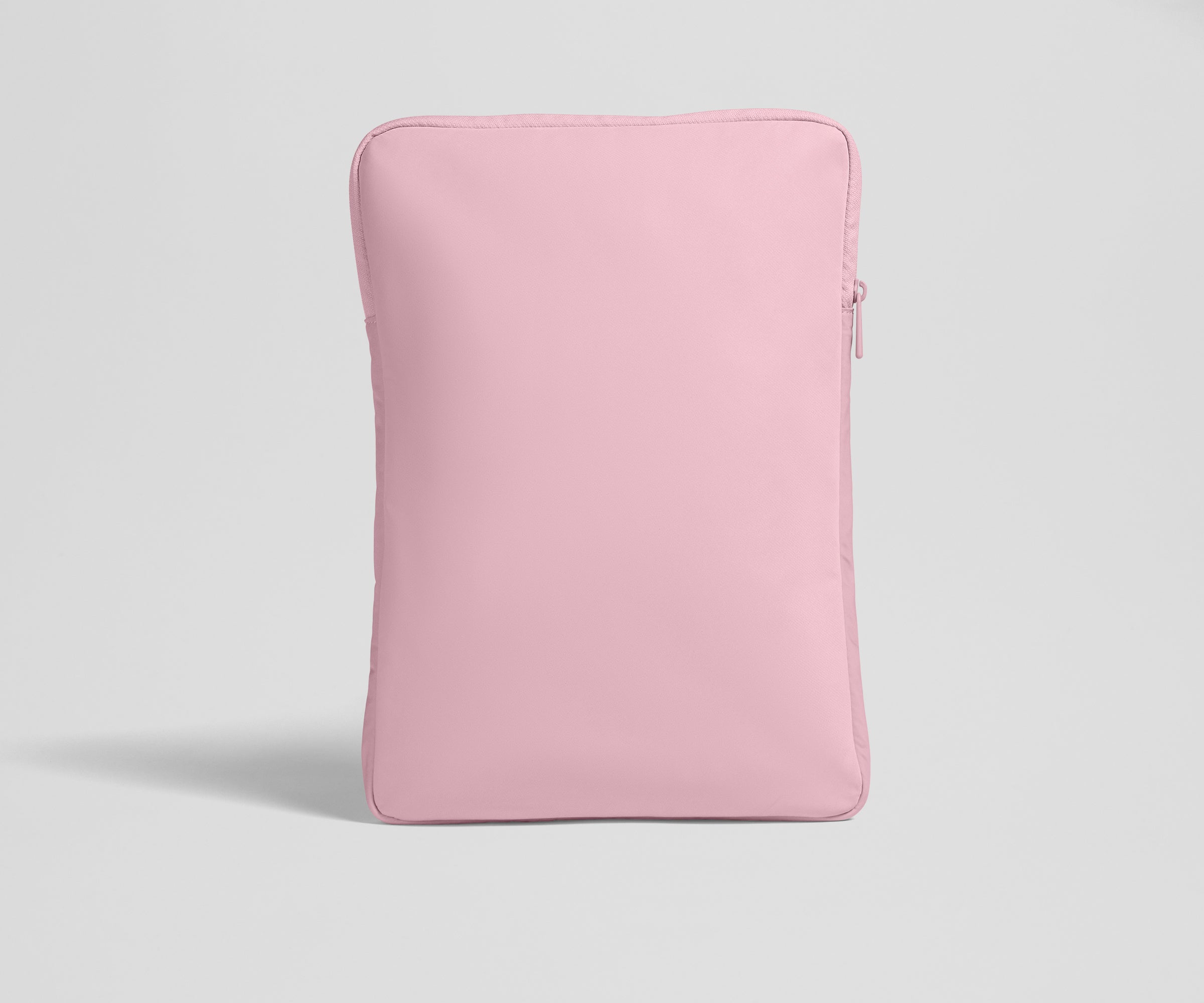 Pink laptop sleeve on a light gray background
