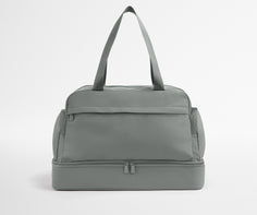 Gray duffel bag on a light gray background