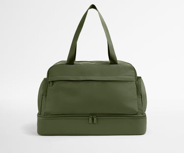 Green duffel bag on a light gray background