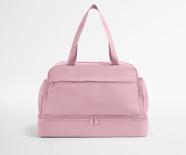 Pink duffel bag on a light gray background