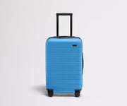 Front product view of The Carry-On Flex suitcase in Splash Blue with raised handle