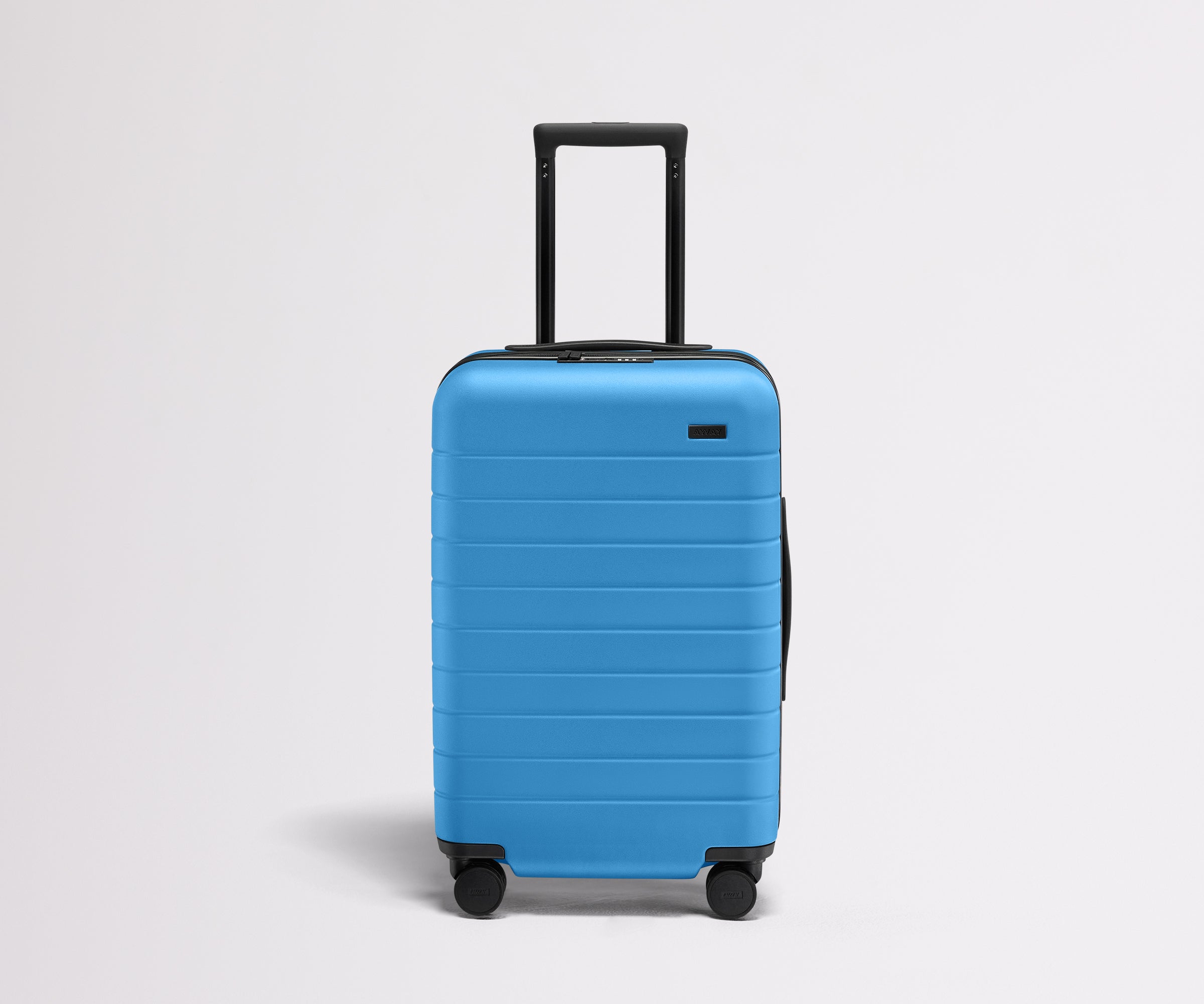 Front product view of The Carry-On Flex suitcase in Splash Blue with raised handle