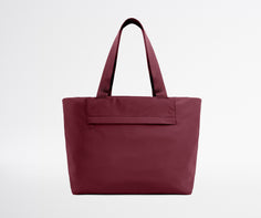 Maroon tote bag on a light gray background