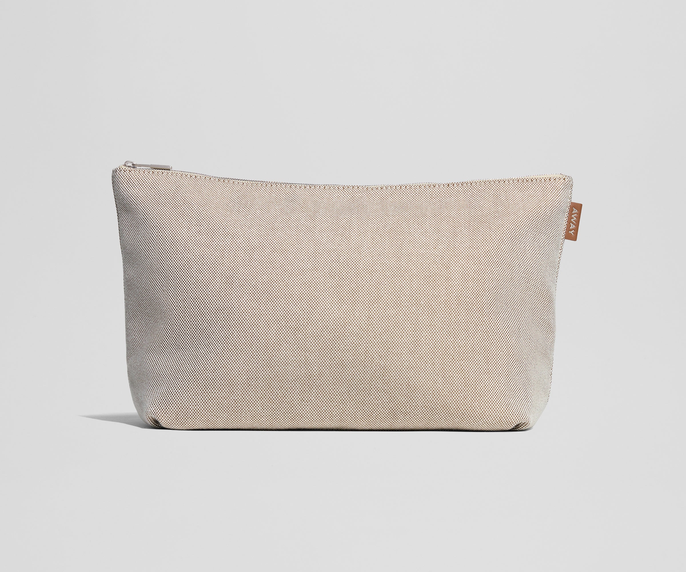 Beige pouch with a zipper on a light gray background