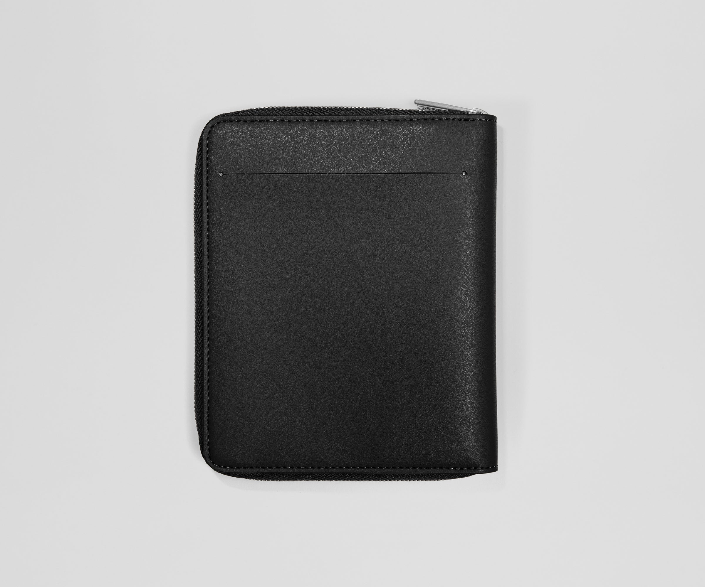 Black leather zippered travel wallet on a light gray background