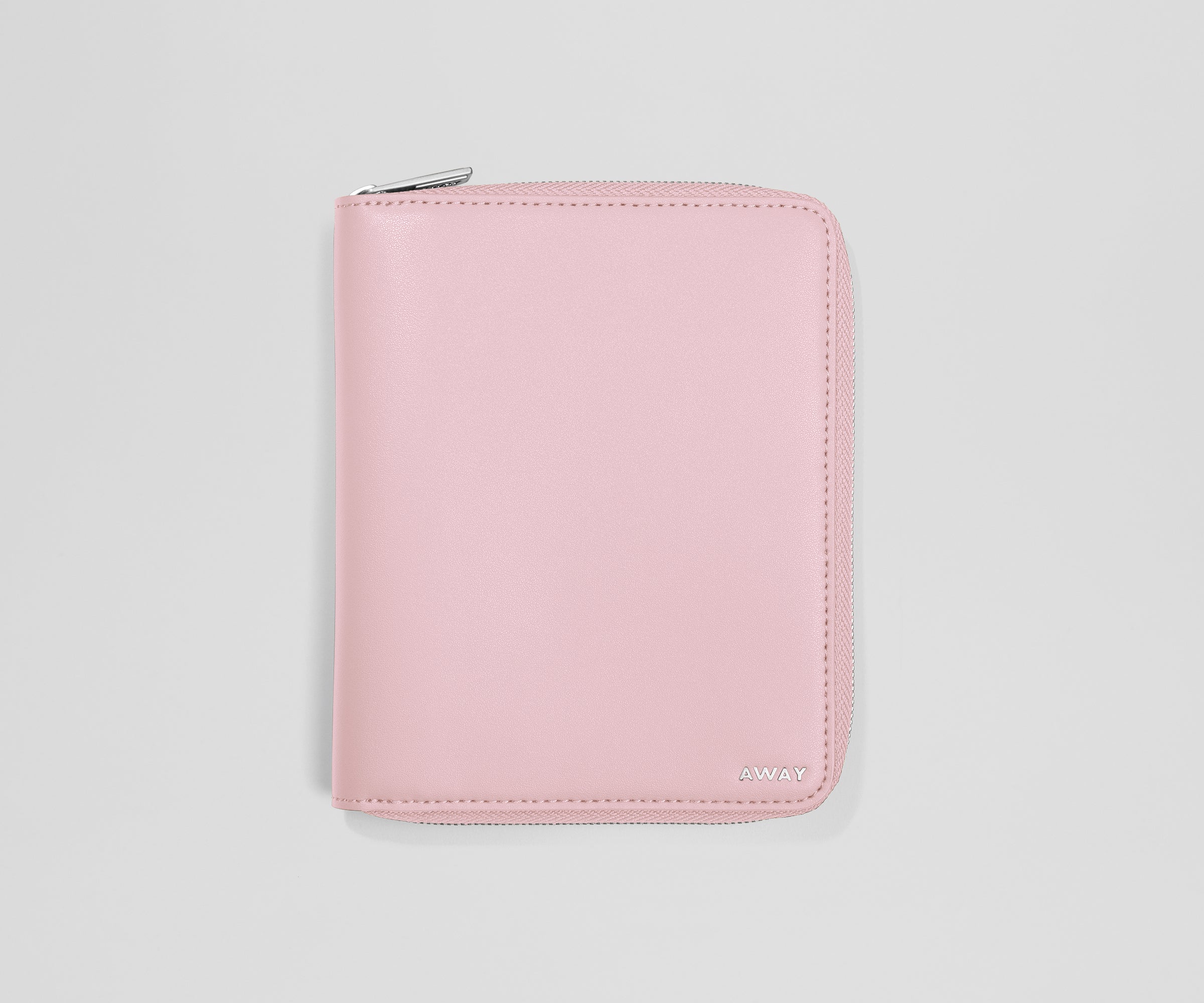 Pink wallet with a brand logo on a light gray background