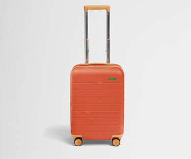 Front product view of The Kids Carry-On suitcase in Poppy Orange with raised handle