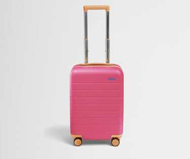 Front product view of The Kids Carry-On suitcase in Cotton Candy Pink with raised handle