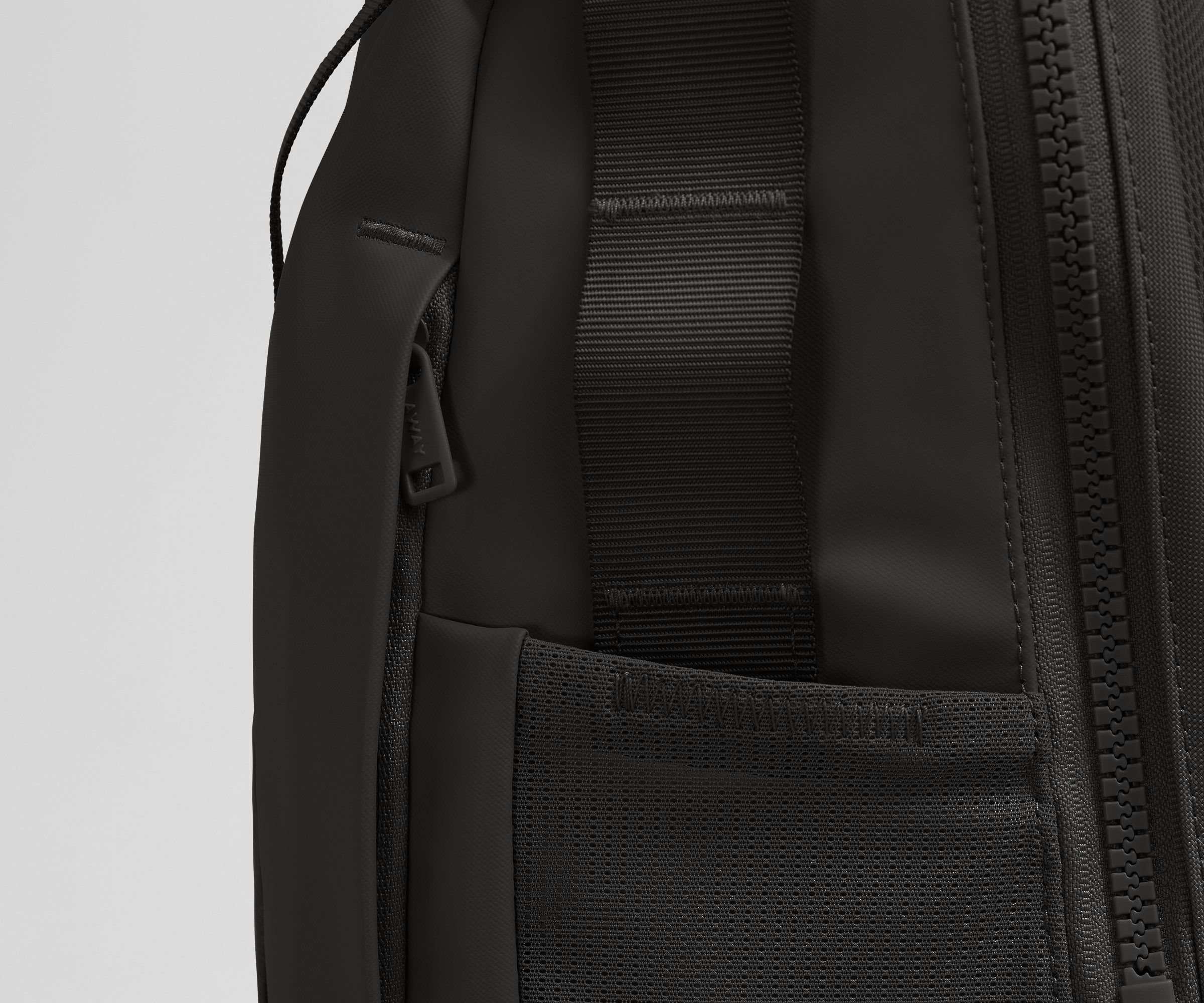 Close up view of the hidden zipper pocket, water bottle pocket, and side webbing loops