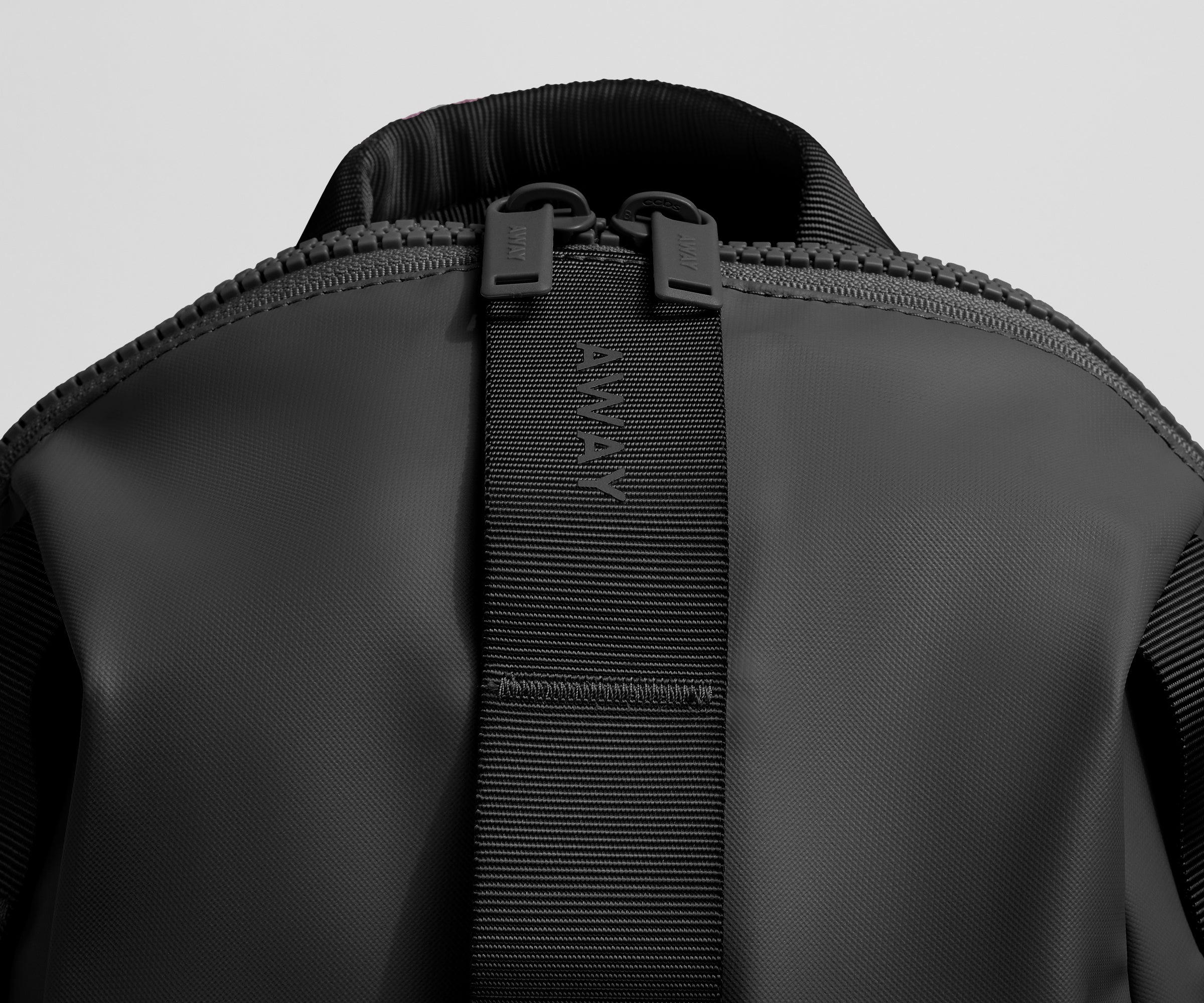 Close up view of the material and Away logo
