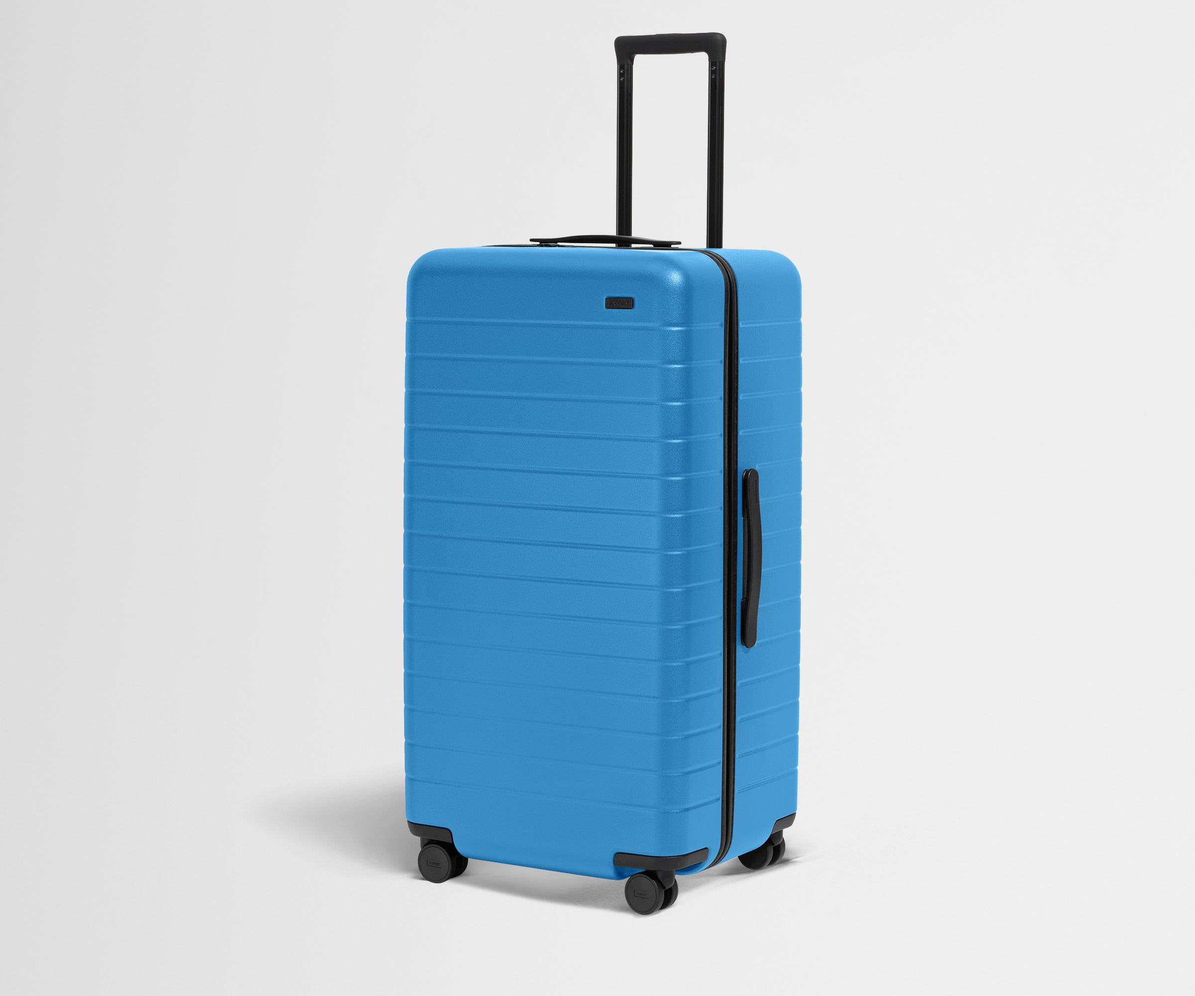Angled product view of The Trunk suitcase in Splash Blue