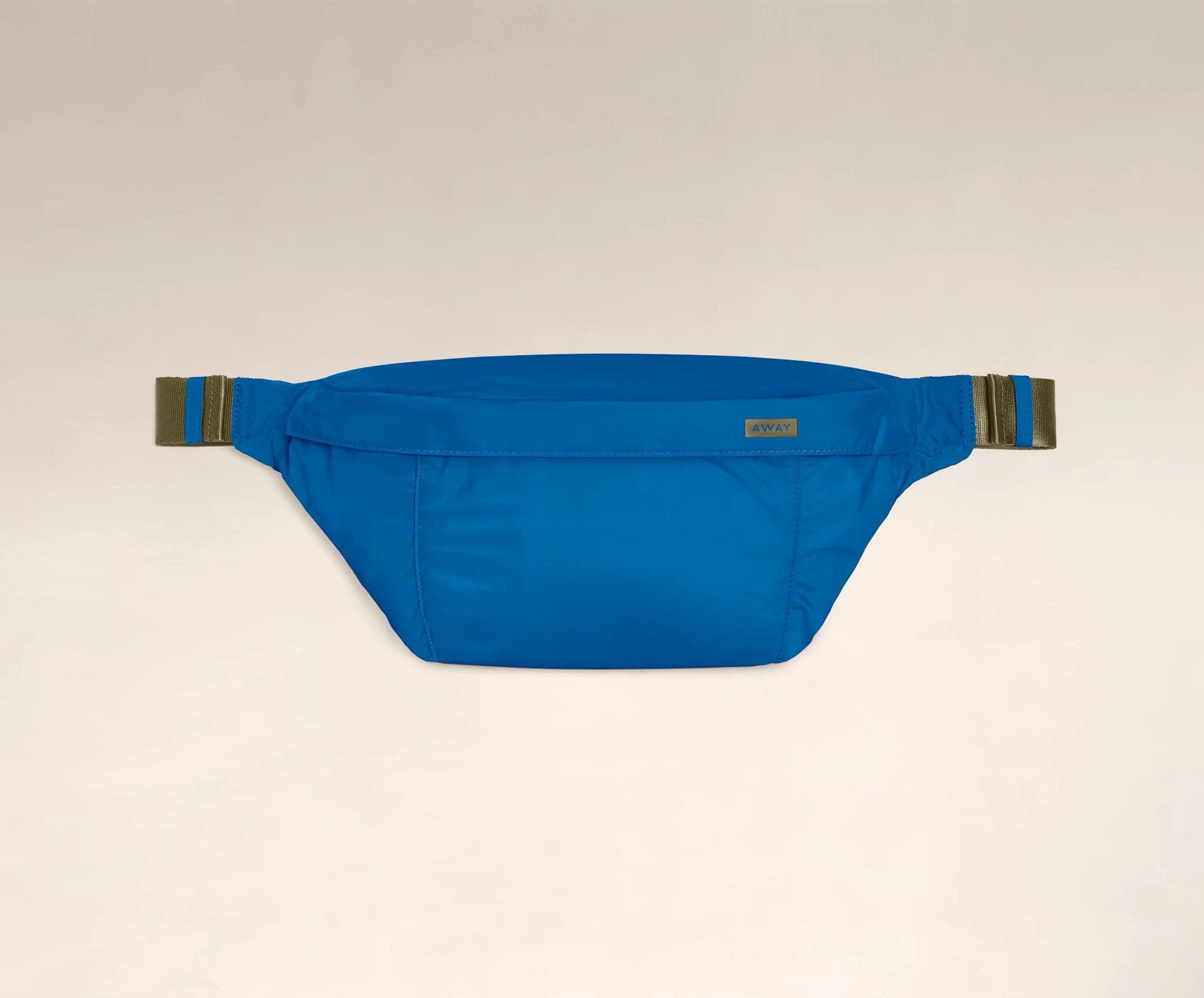 Front view of the Away packable sling bag in the color pacific.