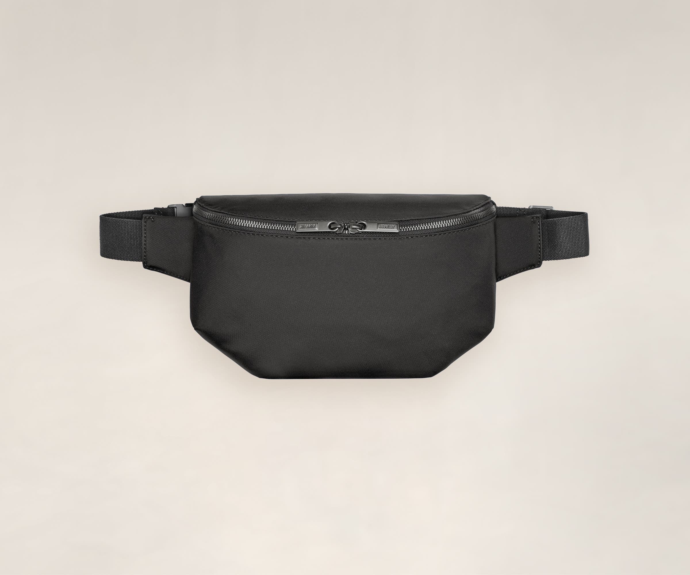 A front view of a sling bag in black.