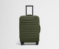 Front product view of The Softside Bigger Carry-On suitcase in Olive Green with raised handle