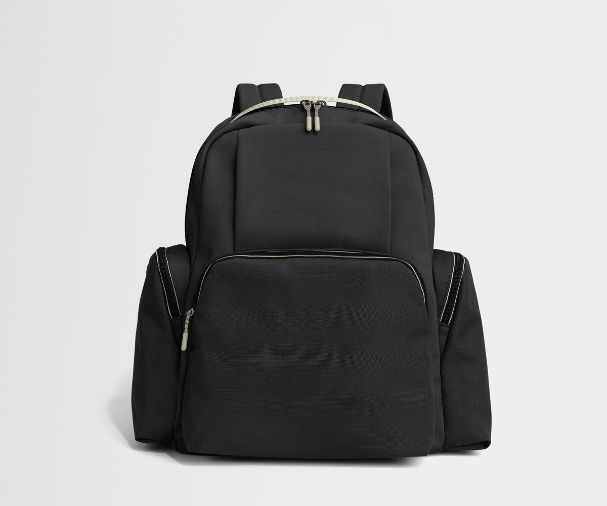 Black backpack on a light gray background