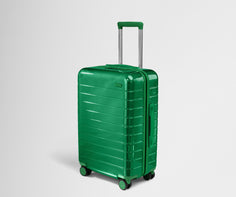 Angled product view of The Bigger Carry-On suitcase in Translucent Green