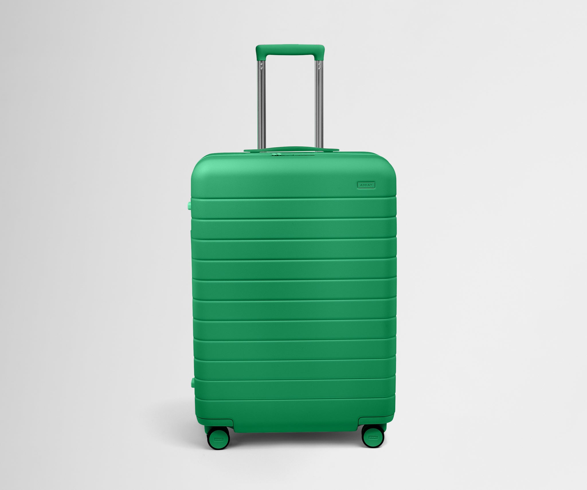 A green hard-shell suitcase with a telescoping handle and wheels.