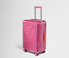 Angled product view of The Bigger Carry-On suitcase in Translucent Pink