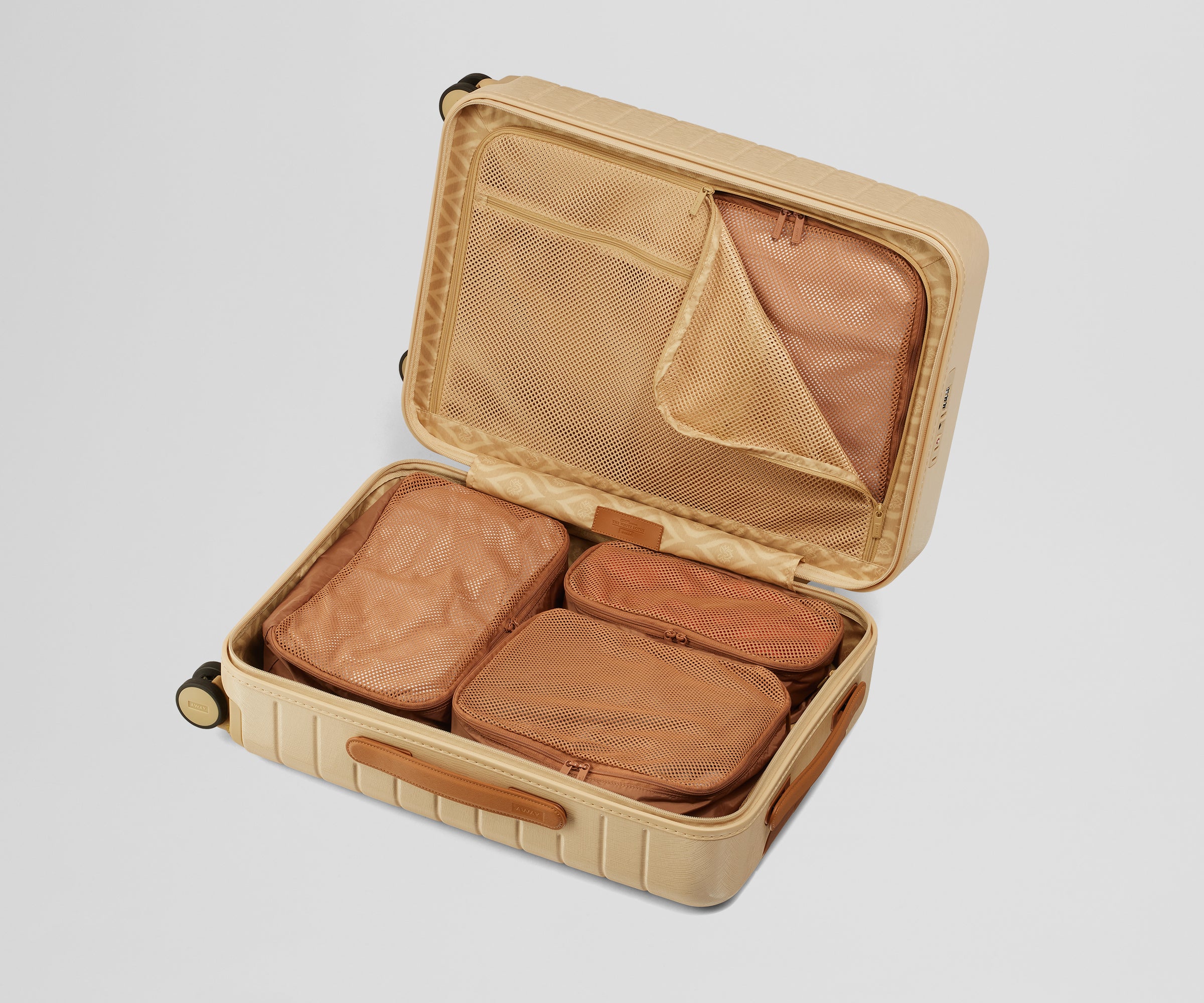 Four Insider Packing Cubes shown inside The White Lotus x Away Bigger Carry-On