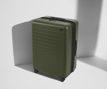 Angled product view of The Large Flex suitcase in Olive Green