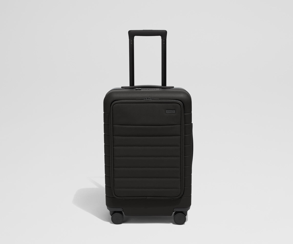 Front product view of The Front Pocket Carry-On suitcase in Jet Black with raised handle