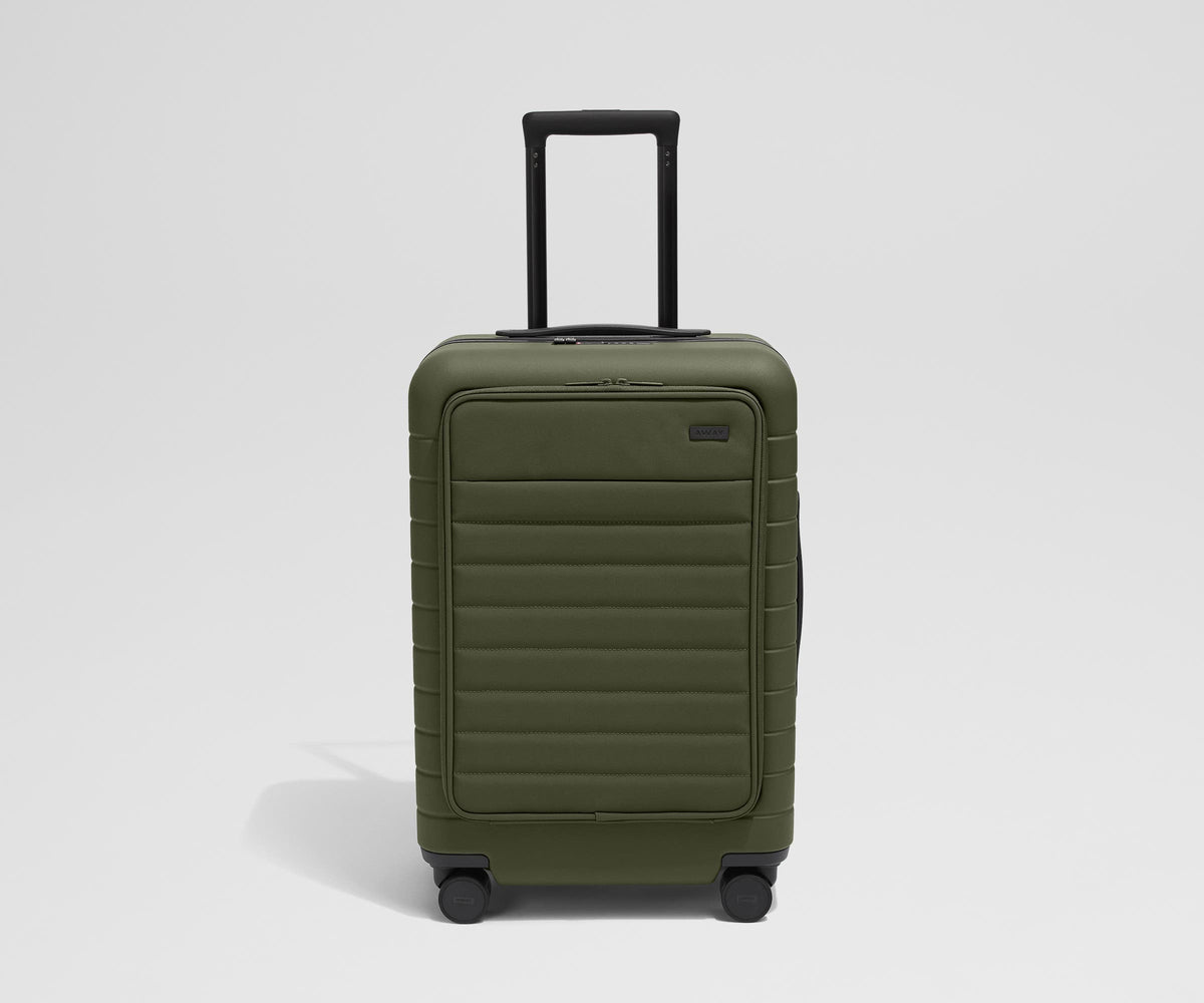 Front product view of The Front Pocket Bigger Carry-On suitcase in Olive Green with raised handle