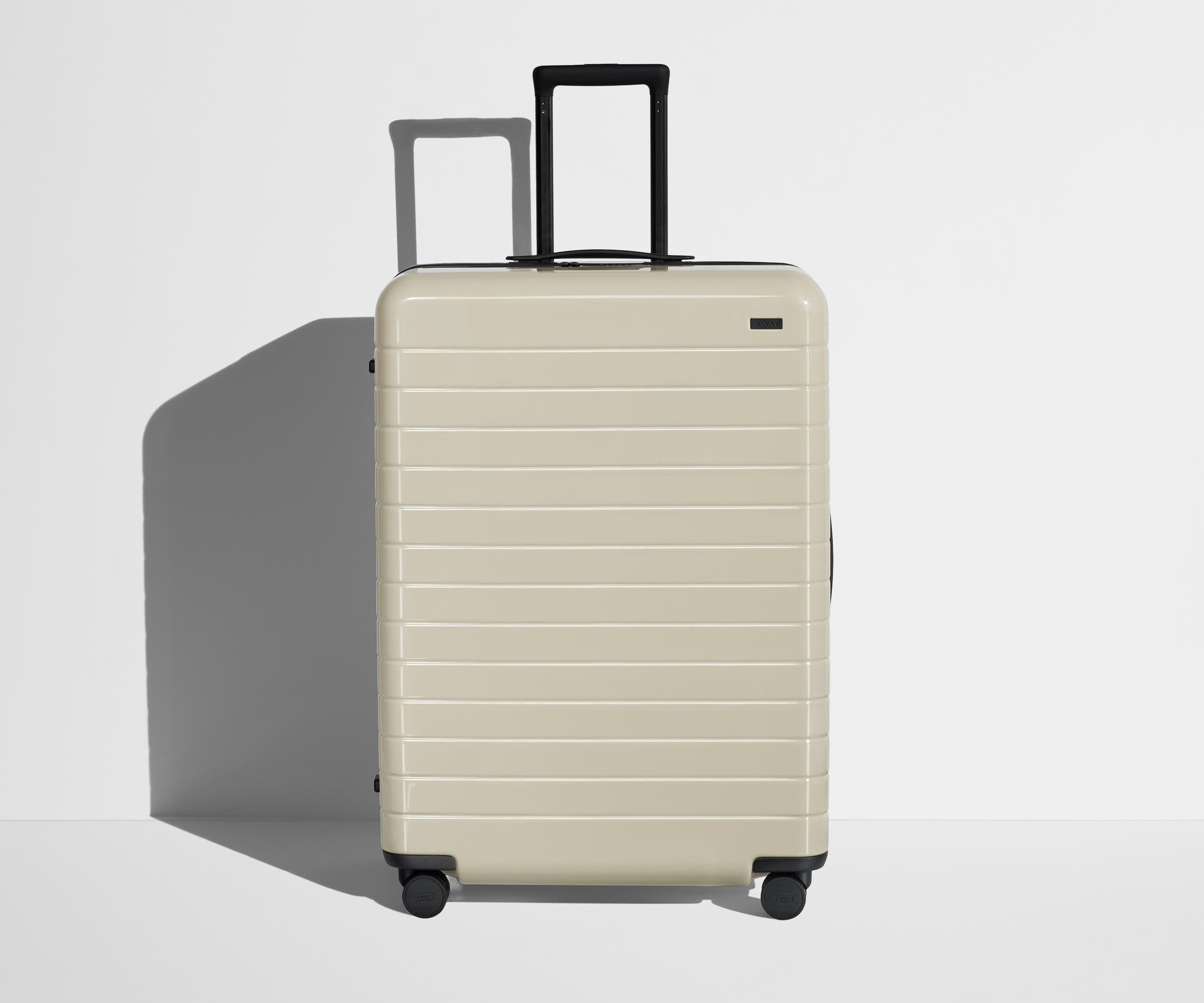Shop Large & Checked Suitcases in Salt White | Away