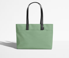 Front view of The Everywhere Tote with its leather handles up