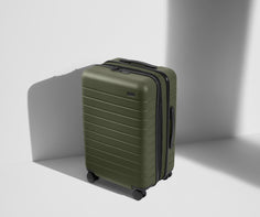 Angled product view of The Bigger Carry-On Flex suitcase in Olive Green