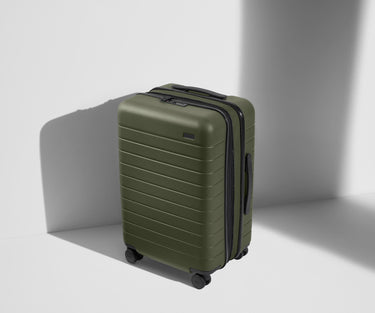 Angled product view of The Bigger Carry-On Flex suitcase in Olive Green