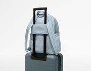 Large Featherlight Backpack on top of an Away suitcase