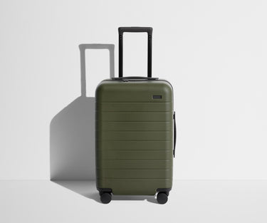 Front product view of The Carry-On suitcase in Olive Green with raised handle