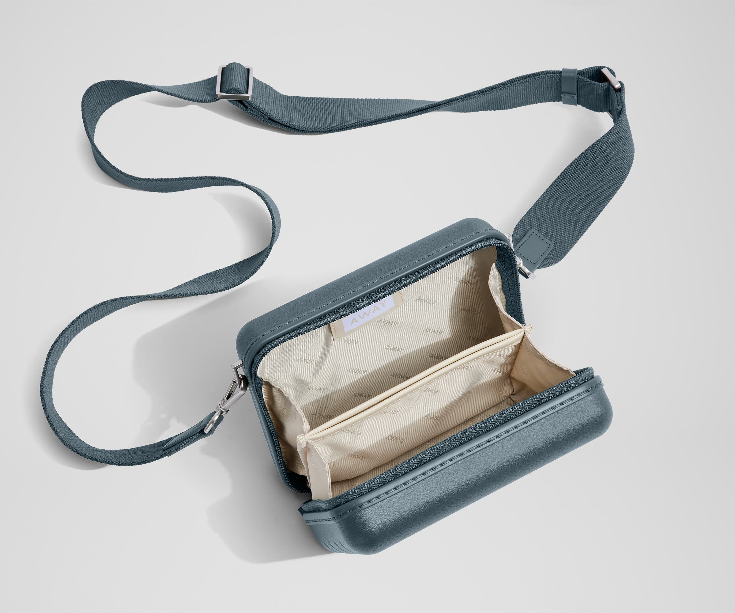 best small travel crossbody bag Away Mini Crossbody in Coast Blue