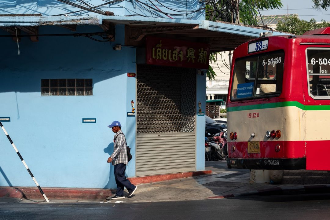 a scene of a bus station in Bangkok
