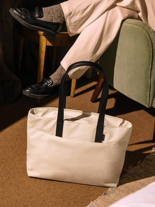 A close up shot of a Everywhere Tote bag in a cafe