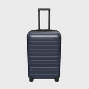The Bigger Carry-On Flex in Navy Blue